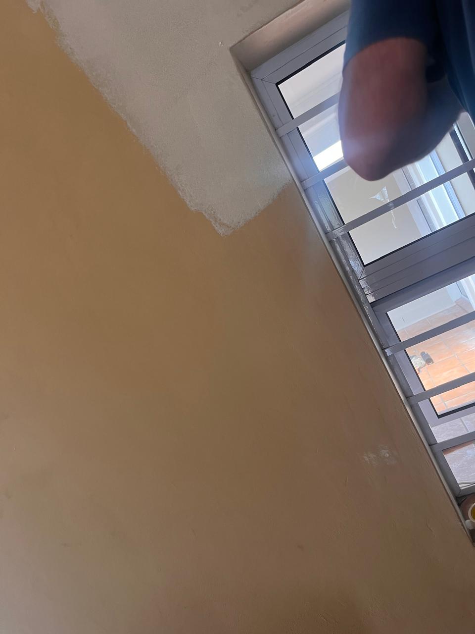 Full interior repaint — lounge with exposed beam ceiling