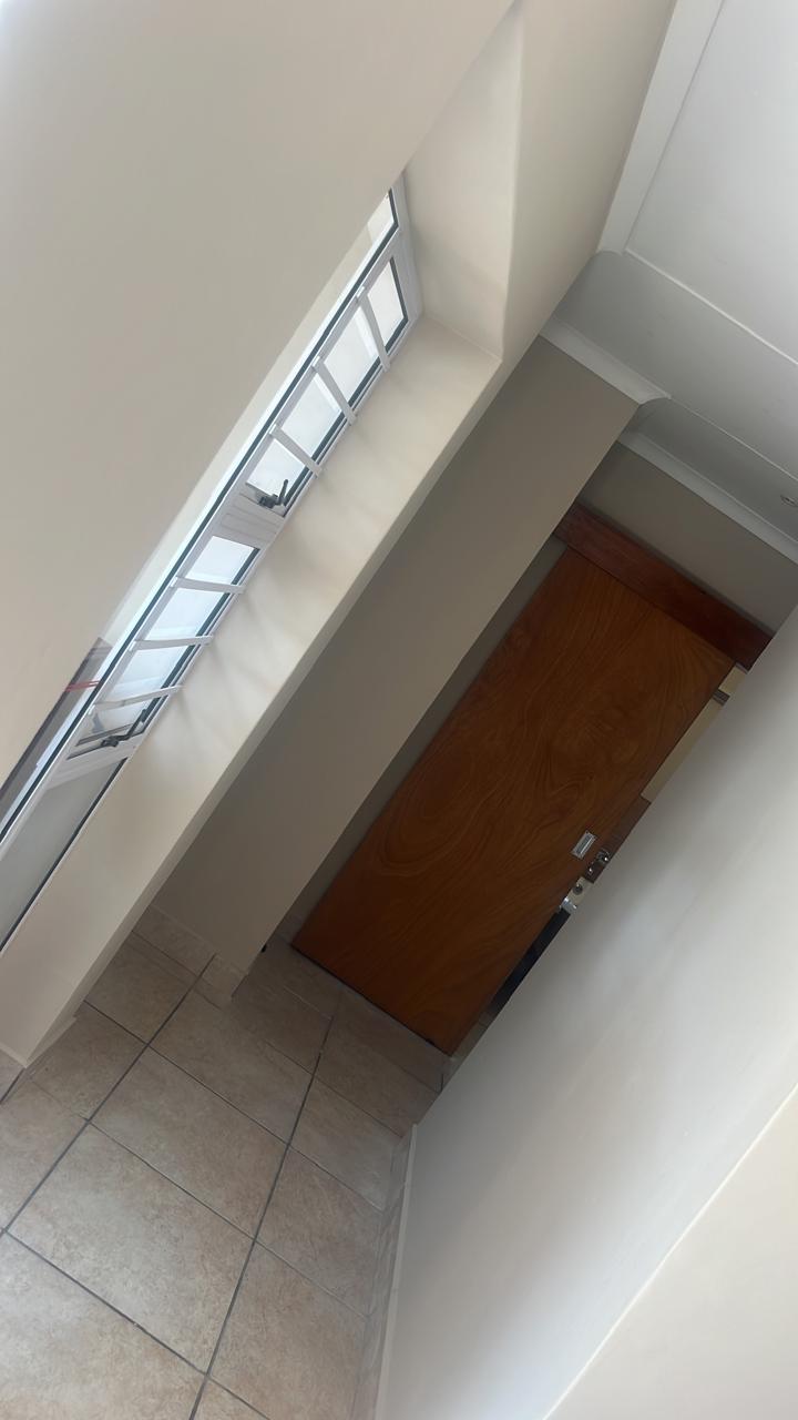 Hallway — completed interior painting, clean white walls