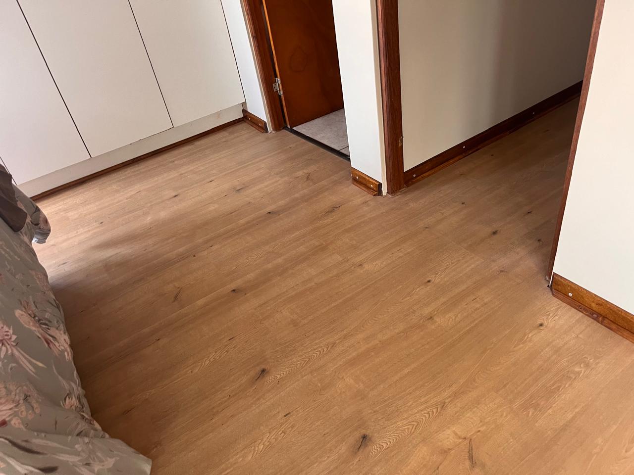 Bedroom — painted walls with new laminate flooring installed